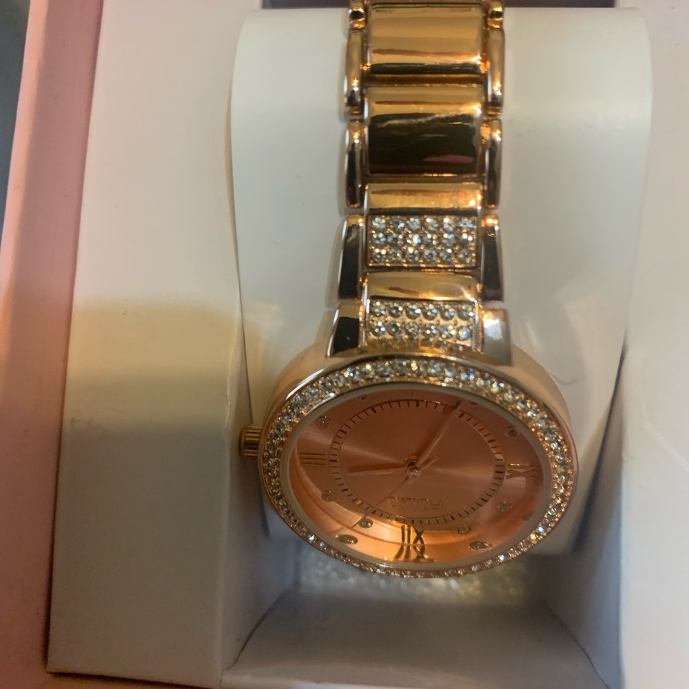 Rose gold watch new in box. Imitation diamond around face.